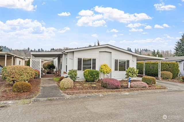 view of front of home featuring a carport