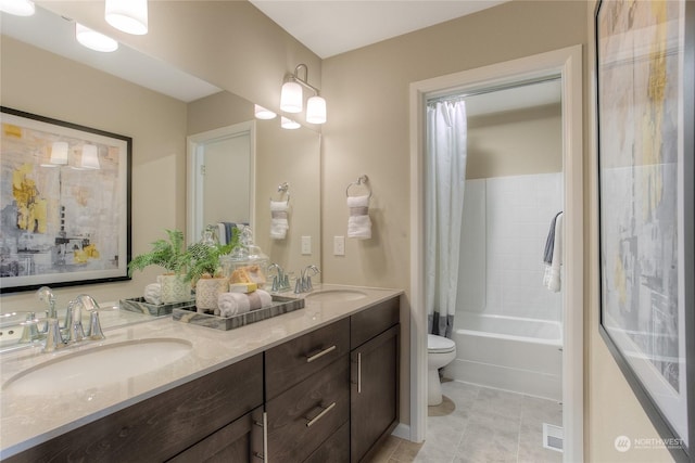 full bathroom with shower / bath combination with curtain, vanity, and toilet