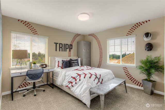 bedroom with light colored carpet and multiple windows