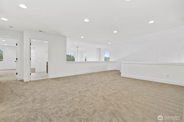 interior space featuring recessed lighting, visible vents, and baseboards