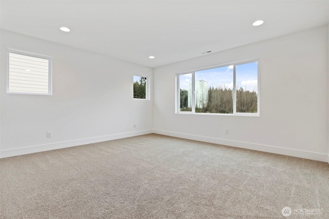 empty room with recessed lighting, carpet flooring, and baseboards