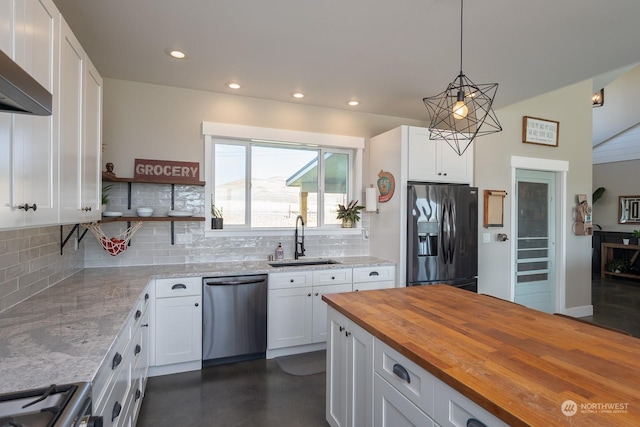 kitchen with sink, white cabinetry, stainless steel appliances, and hanging light fixtures