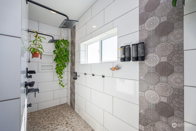 bathroom with a tile shower