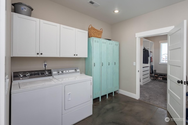 washroom featuring cabinets, dark carpet, and washing machine and clothes dryer