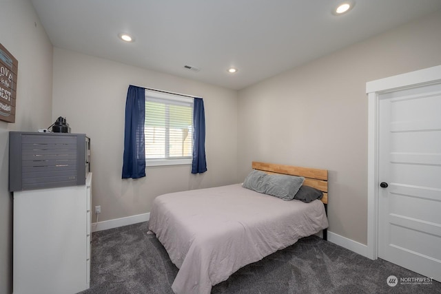 bedroom featuring dark colored carpet