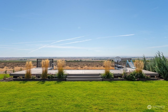 view of yard with a rural view