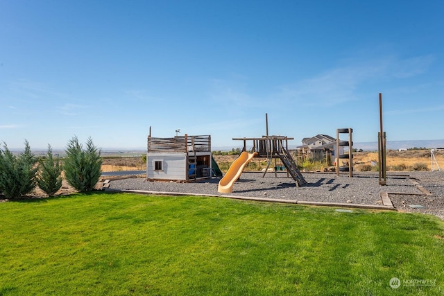 view of playground with a lawn