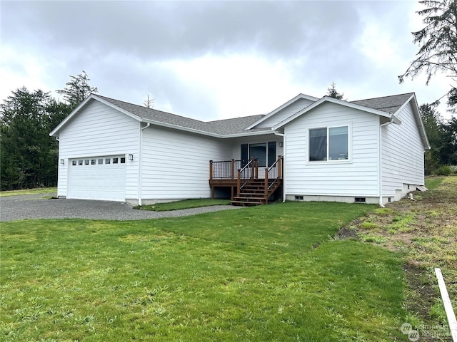 view of front of property with a front yard and a garage