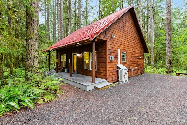 view of side of property with metal roof