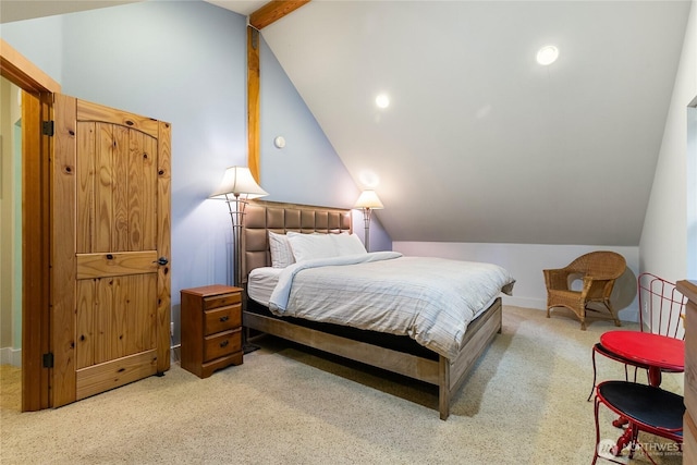 bedroom featuring lofted ceiling, baseboards, and light carpet