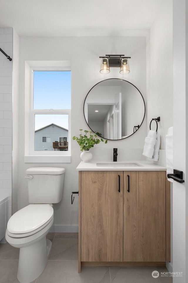 full bathroom featuring toilet, shower / washtub combination, tile patterned floors, and vanity