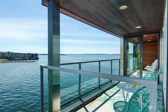 balcony featuring a water view