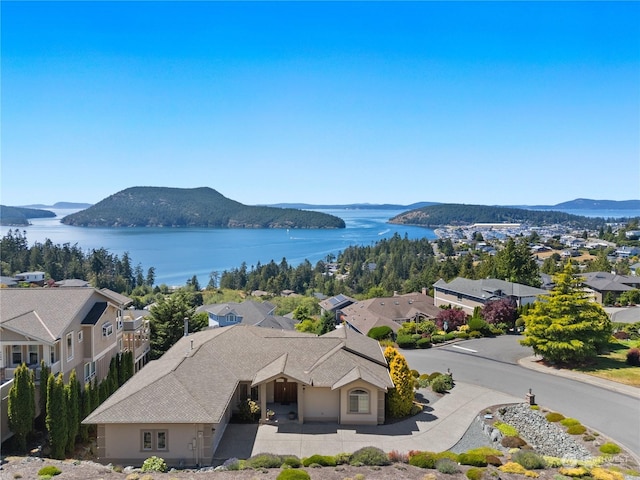 bird's eye view featuring a water and mountain view