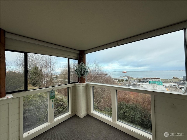 balcony featuring a water view