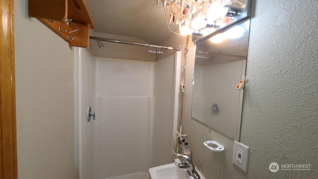 bathroom featuring sink and walk in shower