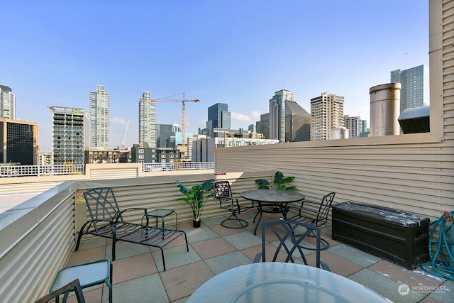 view of patio featuring a balcony