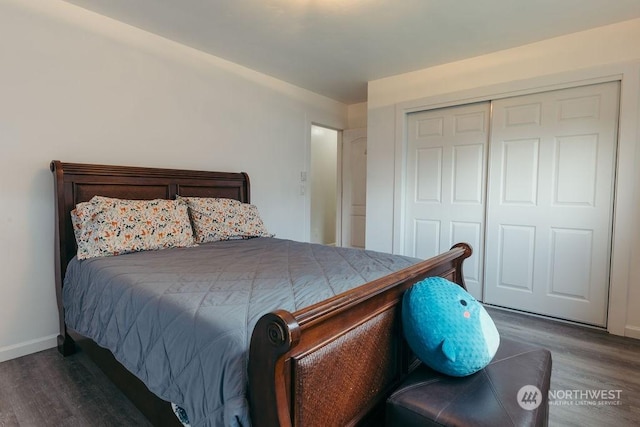 bedroom with a closet and dark hardwood / wood-style floors