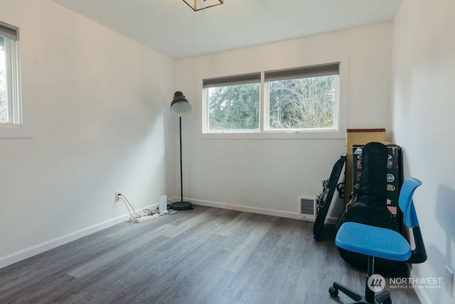 living area with hardwood / wood-style flooring