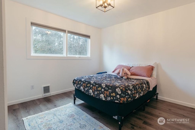 bedroom featuring dark hardwood / wood-style flooring