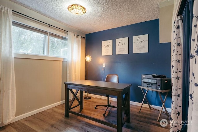 office area featuring a textured ceiling and dark hardwood / wood-style flooring