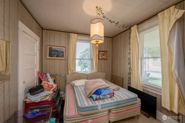 bedroom with wood walls