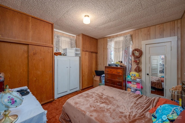 bedroom with wooden walls and a closet