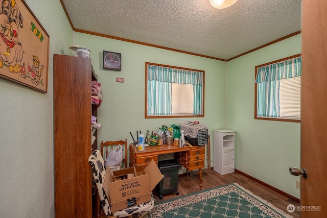 office featuring hardwood / wood-style flooring, ornamental molding, and a textured ceiling