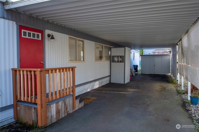 exterior space with a storage unit and a carport