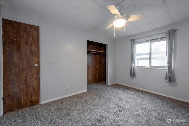 unfurnished bedroom featuring ceiling fan, a closet, and carpet floors