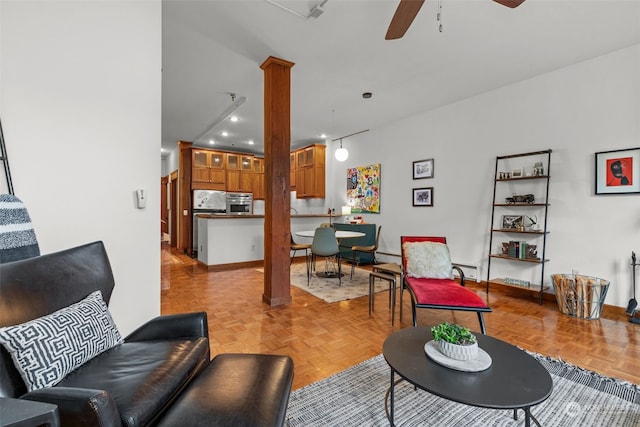 living room featuring ceiling fan and light parquet flooring