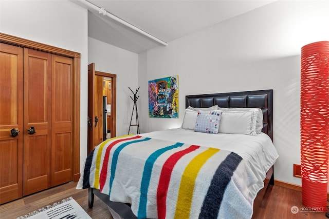 bedroom featuring dark wood-type flooring