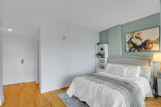 bedroom with light wood-type flooring