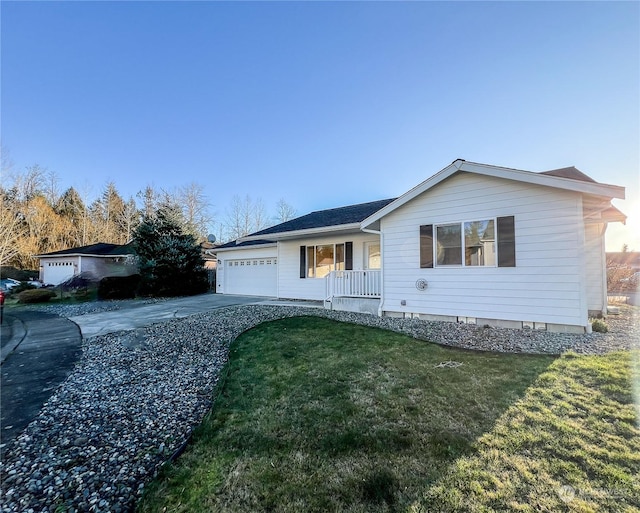 ranch-style home with a front lawn, a porch, and a garage