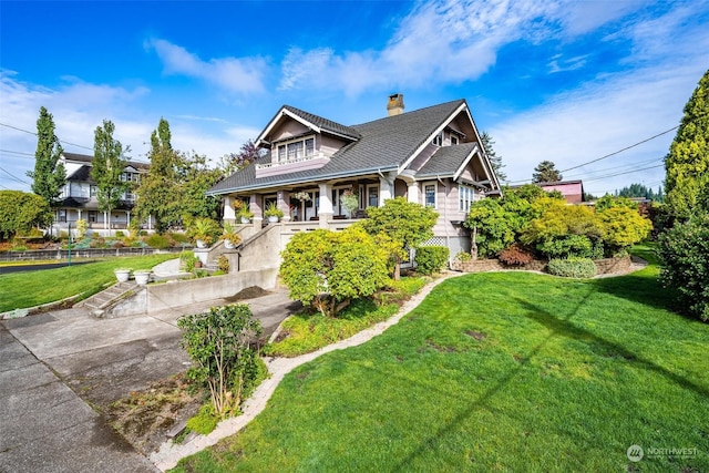 view of front of house featuring a porch and a front yard