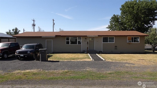 ranch-style home featuring cooling unit