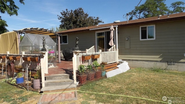 rear view of property with a lawn