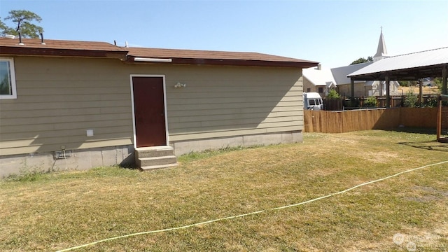 rear view of house with a yard