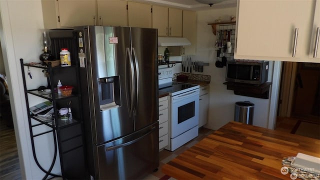 kitchen with stainless steel appliances and wood-type flooring