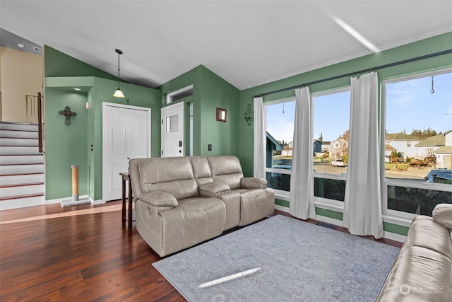 living room featuring vaulted ceiling and dark wood-type flooring