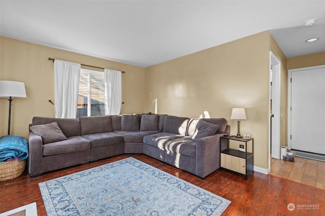 living room with dark hardwood / wood-style flooring