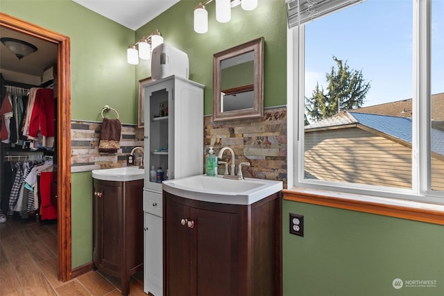 bathroom featuring vanity, hardwood / wood-style flooring, and plenty of natural light