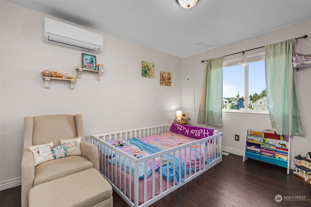 bedroom featuring a wall mounted air conditioner and dark wood-type flooring