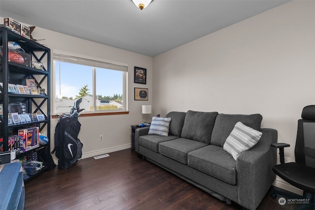 living room with dark hardwood / wood-style flooring