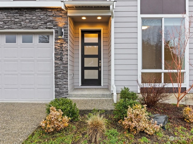 entrance to property featuring a garage