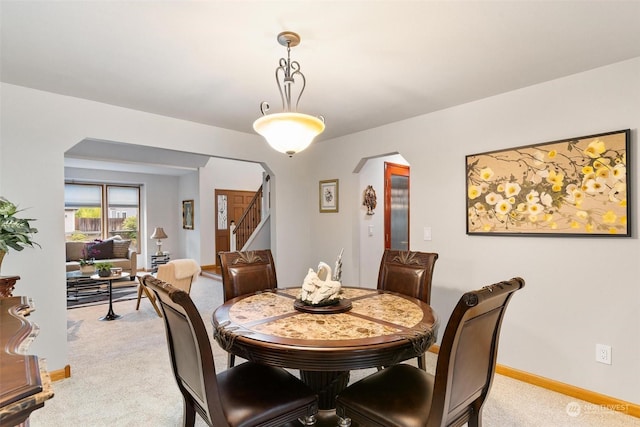 dining area with light carpet