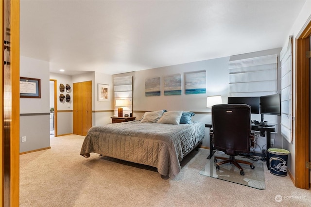 bedroom featuring light carpet