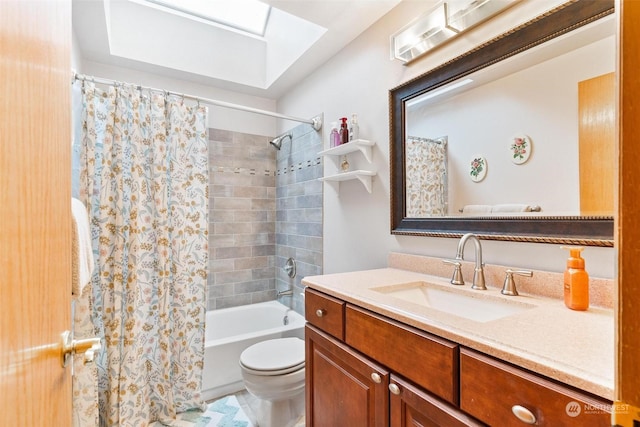 full bathroom with a skylight, vanity, shower / tub combo, and toilet