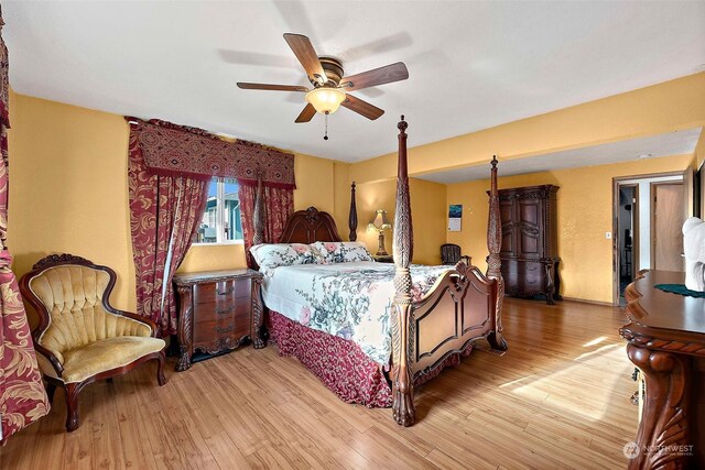 bedroom featuring ceiling fan and light hardwood / wood-style flooring