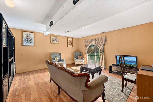 living room with light hardwood / wood-style floors