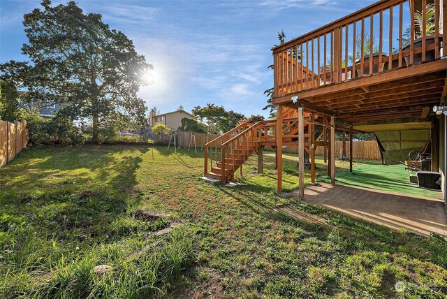 view of yard with a wooden deck